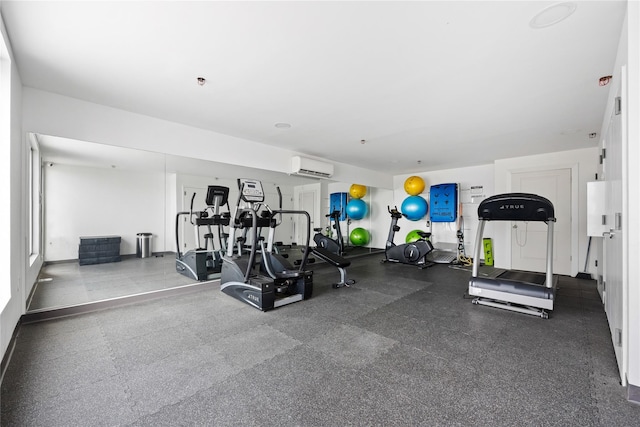 gym with a wall mounted air conditioner