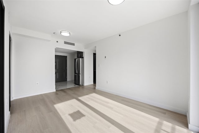 empty room featuring light hardwood / wood-style floors