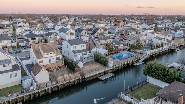 aerial view at dusk with a water view