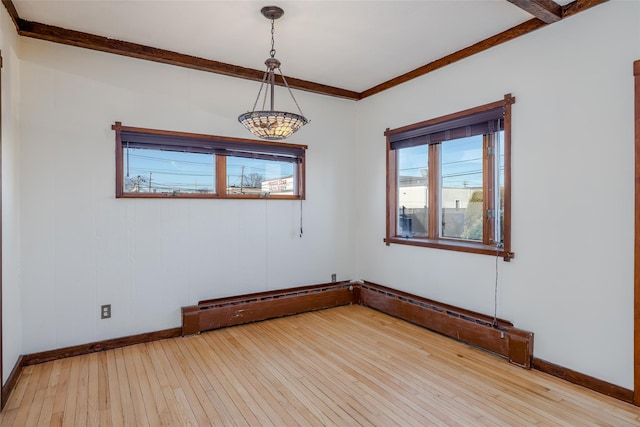 spare room with light hardwood / wood-style flooring and ornamental molding