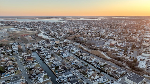 aerial view at dusk with a water view