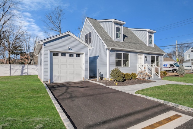 view of front of home featuring a garage and a front yard