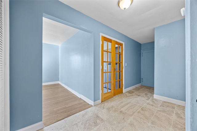 empty room featuring french doors