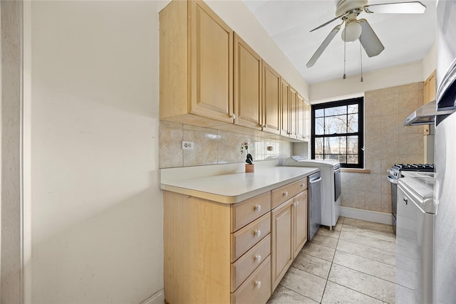 kitchen featuring light tile patterned flooring, appliances with stainless steel finishes, tasteful backsplash, separate washer and dryer, and light brown cabinets