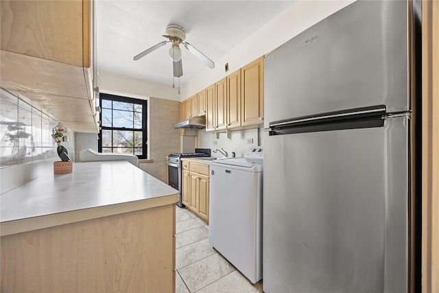 kitchen with light brown cabinetry, washer / clothes dryer, stainless steel appliances, and ceiling fan