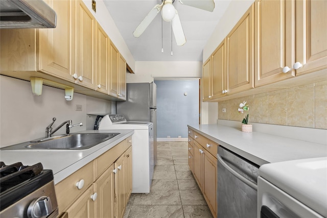 kitchen featuring sink, backsplash, washing machine and clothes dryer, light brown cabinetry, and stainless steel dishwasher