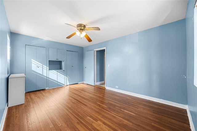 interior space with hardwood / wood-style flooring and ceiling fan