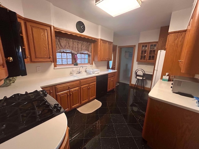 kitchen with sink, black dishwasher, a wall mounted air conditioner, gas range, and white fridge