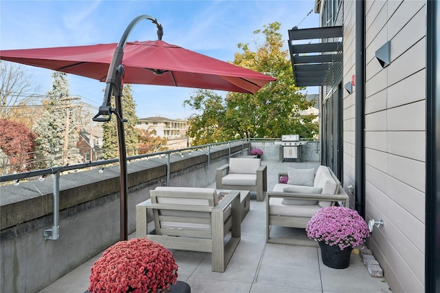 balcony featuring an outdoor living space and grilling area