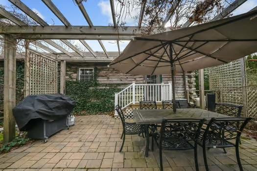 view of patio / terrace with grilling area and a pergola