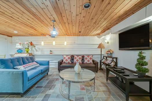 living room featuring wood ceiling