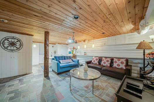 living room with wood ceiling