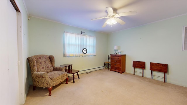 living area featuring light carpet, a baseboard heating unit, ornamental molding, and ceiling fan