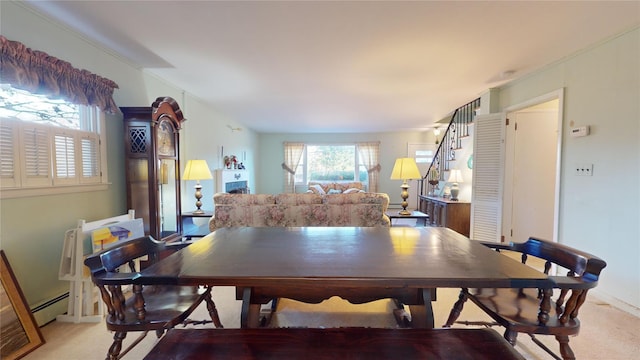 dining area featuring a baseboard heating unit