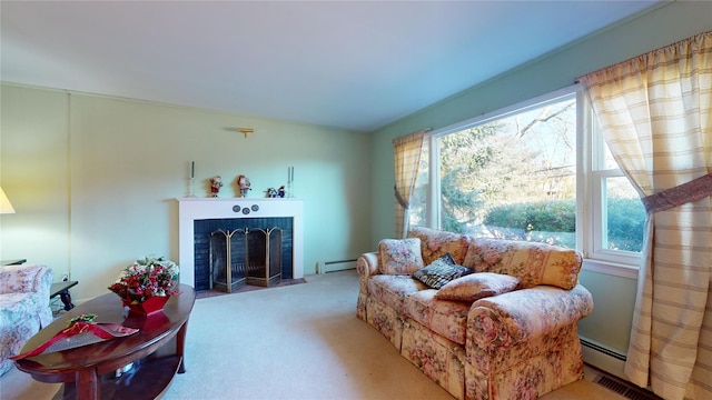 carpeted living room featuring a baseboard radiator and a brick fireplace