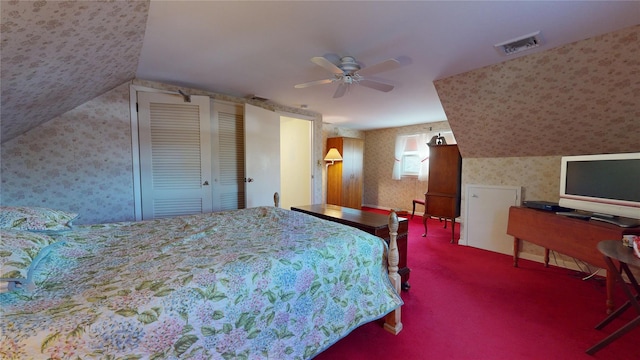 carpeted bedroom with ceiling fan and lofted ceiling