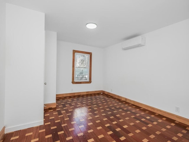 empty room featuring dark hardwood / wood-style flooring and a wall mounted air conditioner