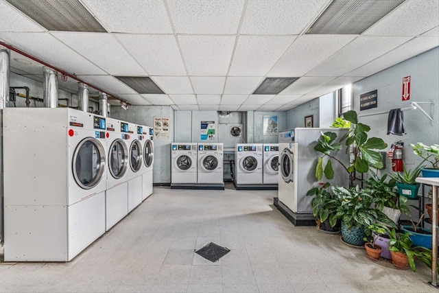 washroom featuring washer and clothes dryer