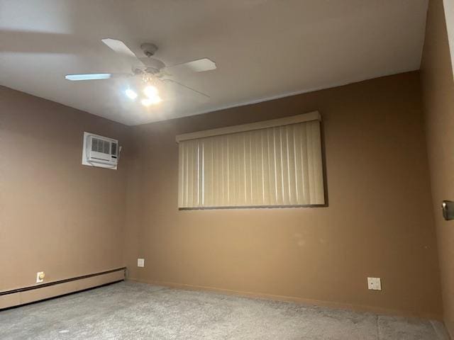 empty room with a baseboard heating unit, a wall mounted AC, light colored carpet, and ceiling fan