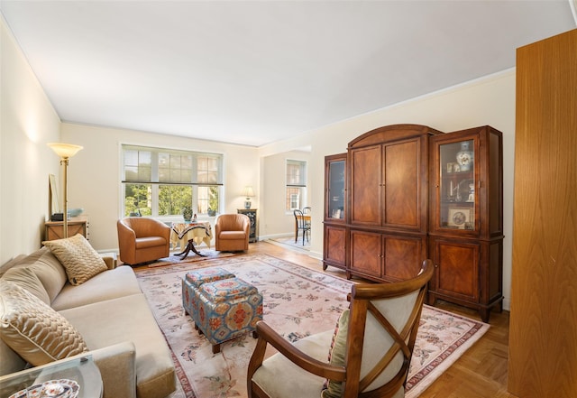 living room featuring parquet flooring