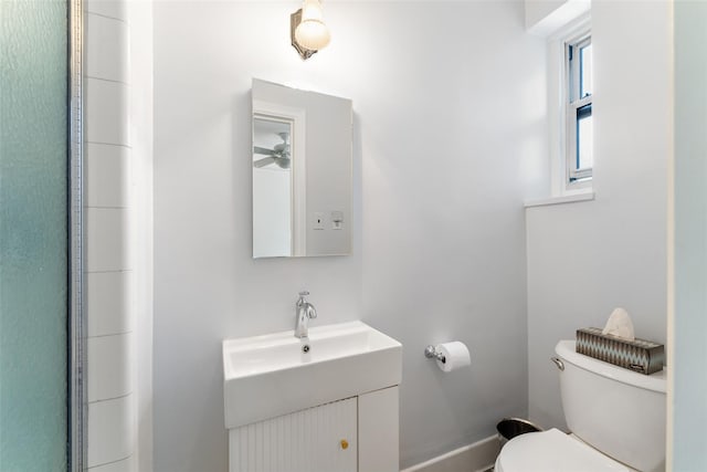 bathroom featuring vanity and toilet