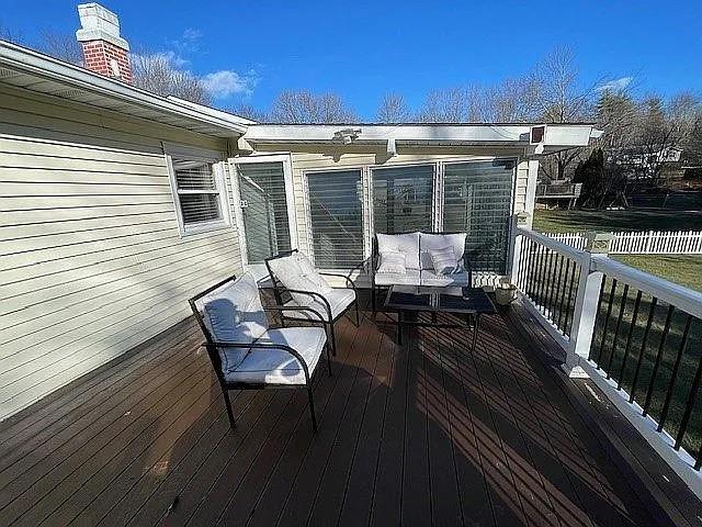 wooden terrace featuring outdoor lounge area