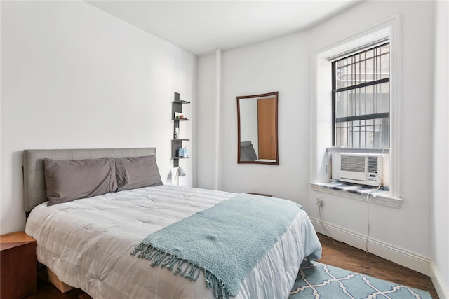 bedroom featuring cooling unit and hardwood / wood-style flooring