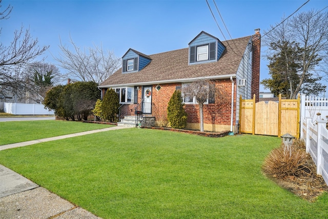 cape cod-style house with a front lawn