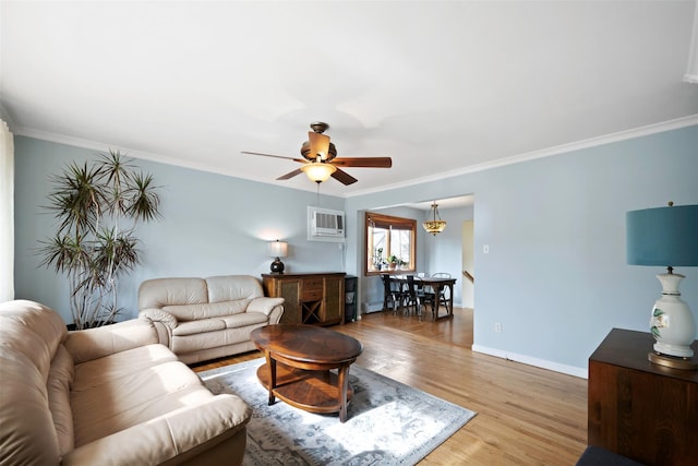 living room featuring a wall mounted AC, ornamental molding, hardwood / wood-style floors, and ceiling fan