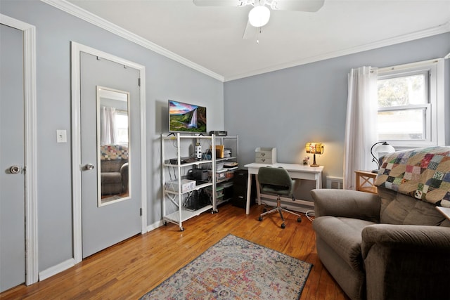 office space with crown molding, hardwood / wood-style flooring, and ceiling fan