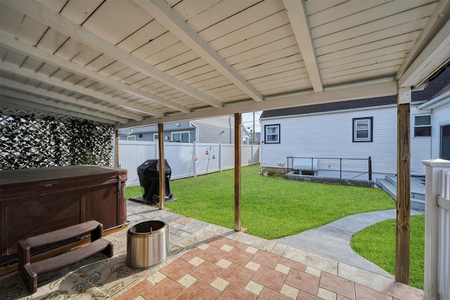 view of patio featuring area for grilling and a hot tub