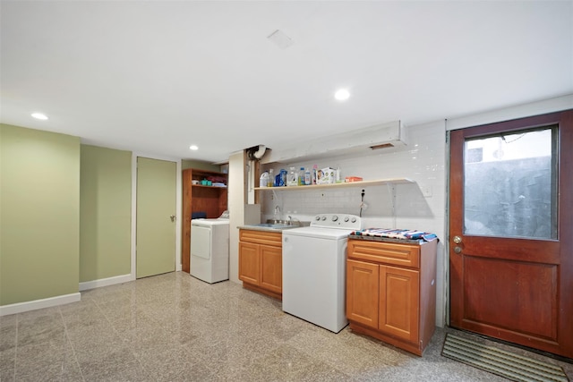 laundry area with sink and washer / dryer