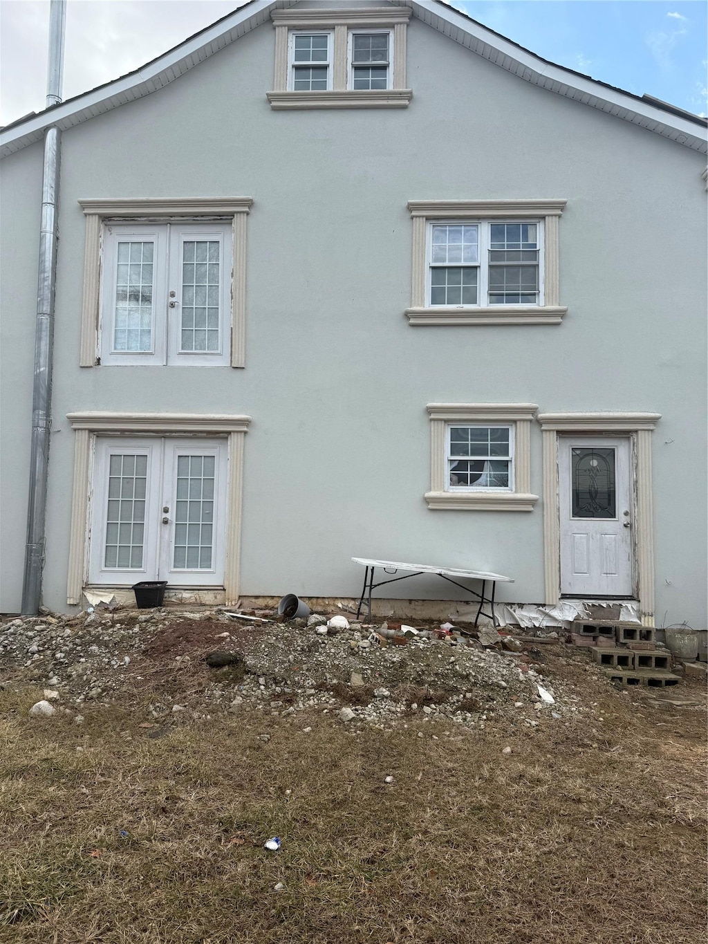 rear view of property featuring french doors