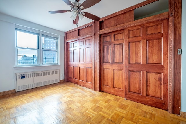 3725 Henry Hudson Pkwy Unit 6D, Bronx, NY 10463 - unfurnished bedroom featuring ceiling fan, radiator heating unit, and light parquet floors