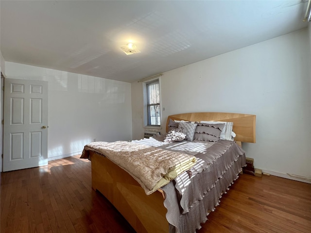 bedroom featuring dark hardwood / wood-style flooring