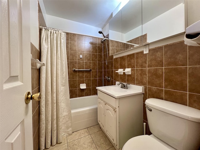 full bathroom featuring tile walls, tile patterned flooring, vanity, shower / tub combo, and toilet