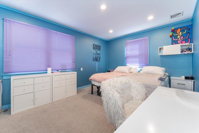 bedroom with light colored carpet