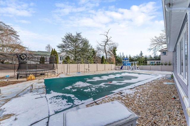 view of pool with a playground and a trampoline