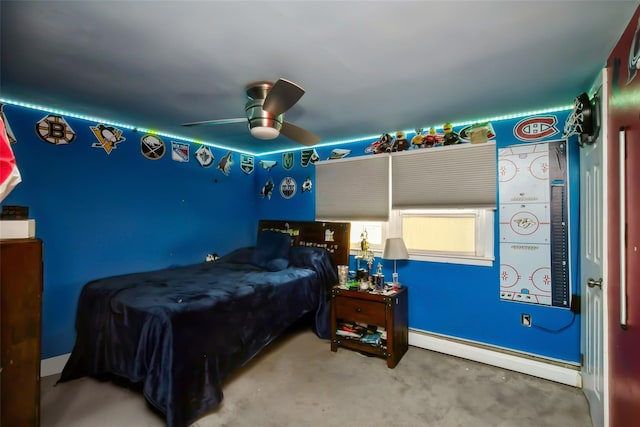 bedroom featuring baseboard heating and a ceiling fan