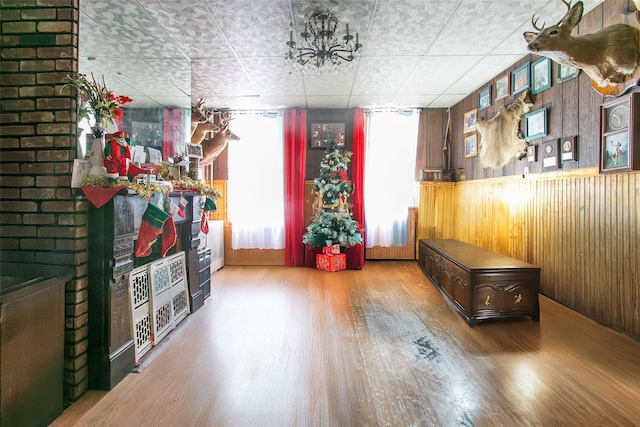 interior space featuring hardwood / wood-style floors and wood walls