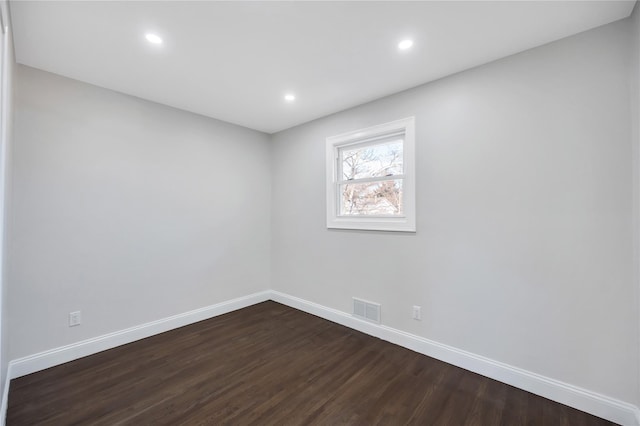 empty room featuring dark hardwood / wood-style floors