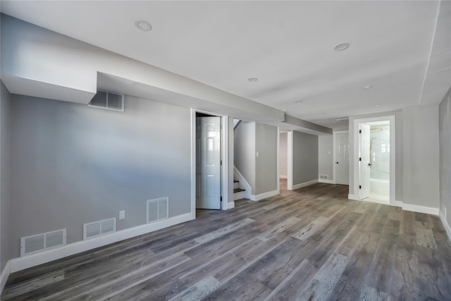 basement featuring dark hardwood / wood-style flooring