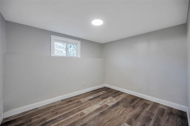 unfurnished room featuring dark wood-type flooring