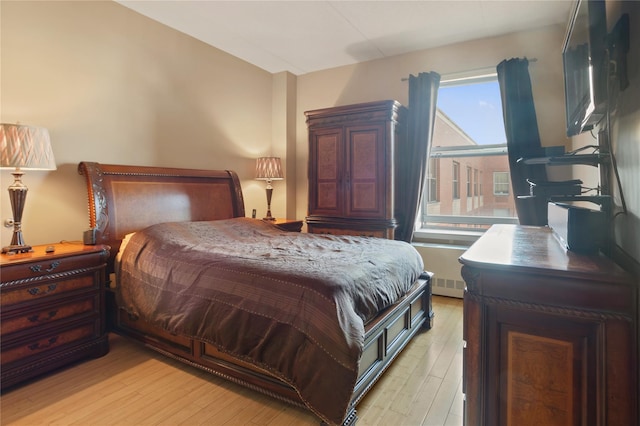 bedroom with light wood-type flooring