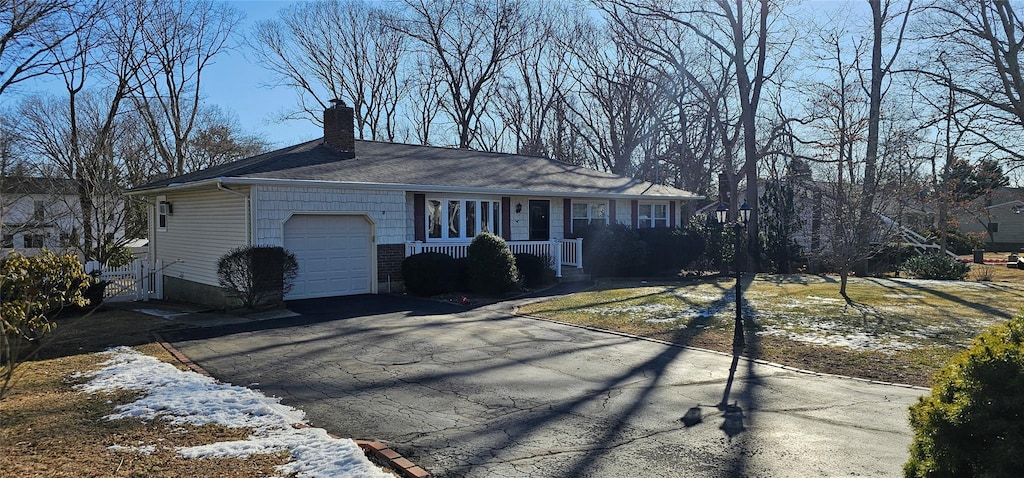 ranch-style house featuring a garage