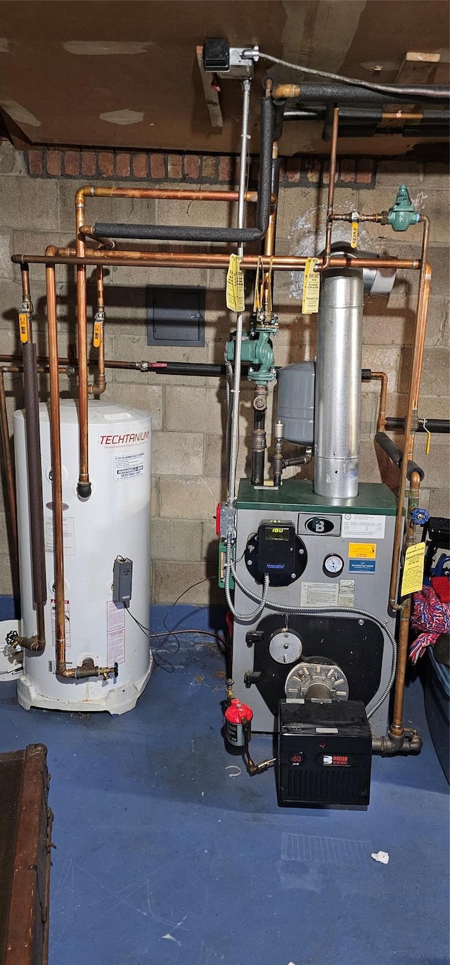 utility room featuring water heater