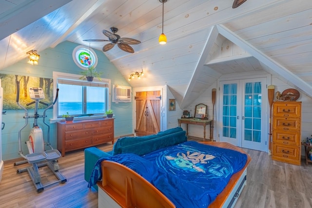 bedroom featuring a wall mounted air conditioner, lofted ceiling, wood ceiling, a water view, and light wood-type flooring