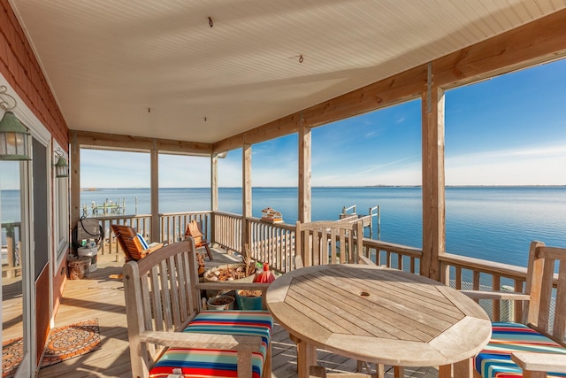 sunroom with a water view