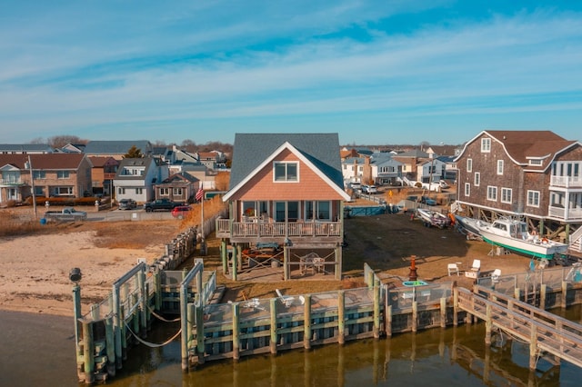 rear view of house with a water view