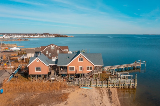 birds eye view of property featuring a water view